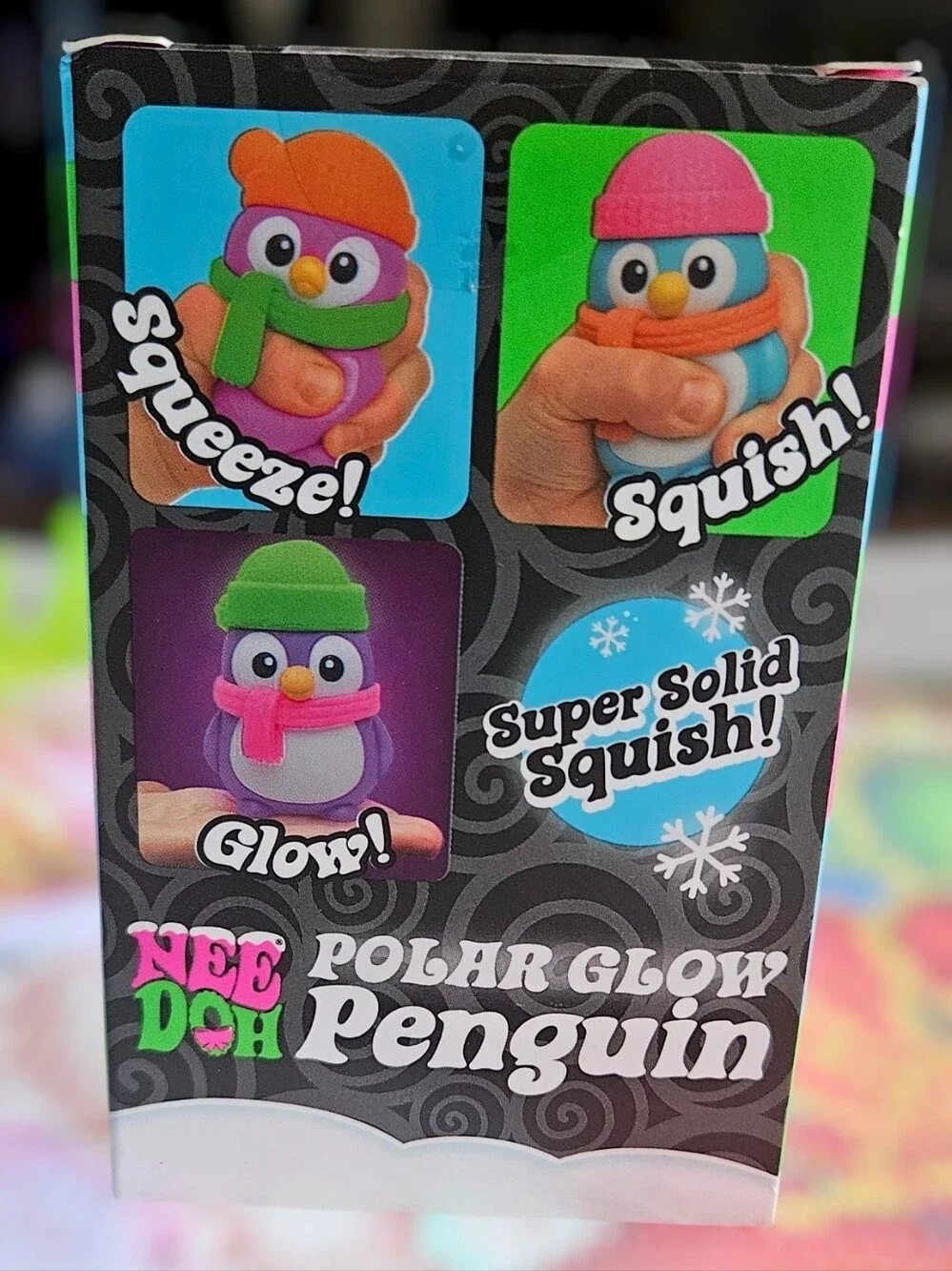 NeeDoh Polar Glow Penguin Squishy Toy - Blue Body, Pink Hat, Orange Scarf